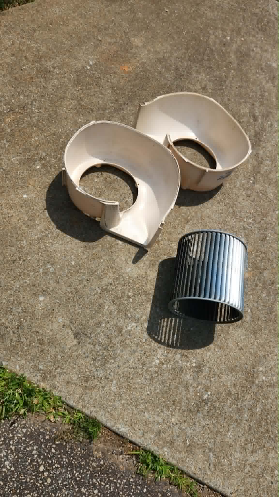 Disassembled blower housing and wheel after cleaning