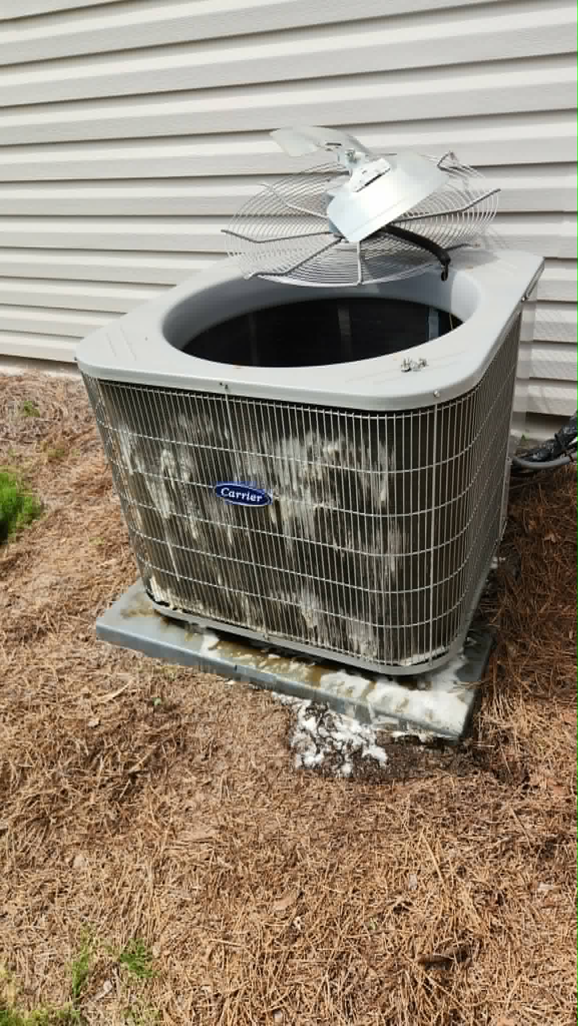 Condenser coated in foaming coil cleaner mid-treatment