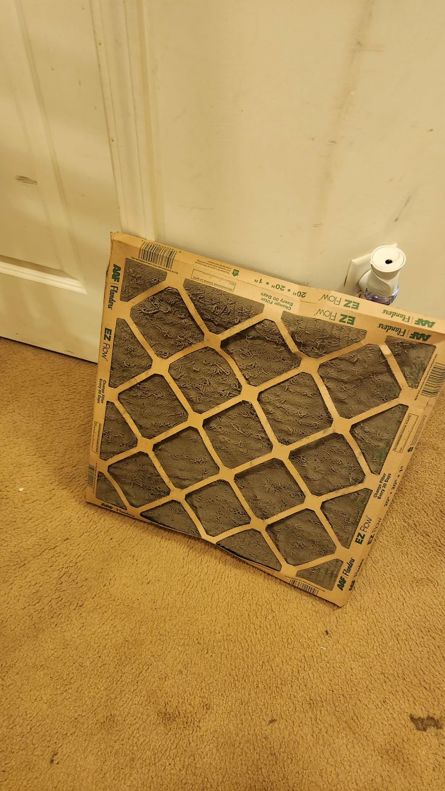 A severely clogged air filter pulled from a return